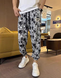 Pantalones cortos informales con abertura lateral y estampado de seda helada para hombre (50% de descuento)