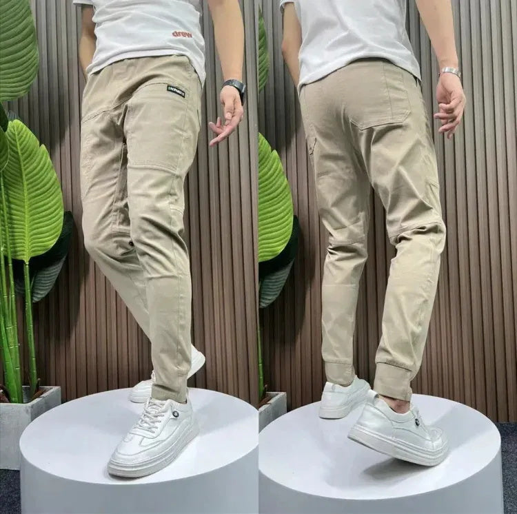 Pantalones cargo ajustados con múltiples bolsillos y elasticidad alta para hombre👖