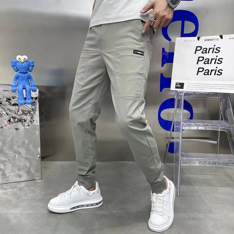 Pantalones cargo ajustados con múltiples bolsillos y elasticidad alta para hombre👖